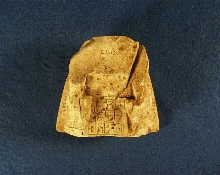 Fragment of a figurine of Tsjembu as scribe