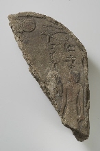 Fragment of a painted stela with inscription