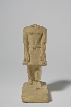 Fragment of a statue of a standing man with inscription