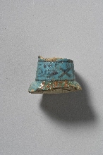 Fragment of a funerary figurine with inscription