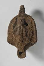 Lamp with closed reservoir, lid decorated with human figure