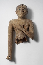 Upper part of a figurine, covered in plaster
