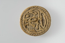 Button seal decorated with lizard, man and Hathor sistrum