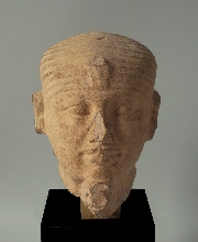 Head of anonymous king with headband and uraeus
