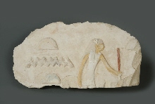 Fragment of a relief: woman, with inscription
