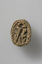 Scarab with figure holding two crocodiles