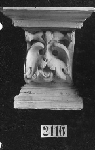 Console with foliage with the shape of a mask