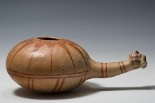 Round vessel with a human head on its handle