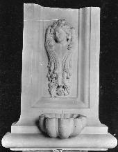 Holy water font with winged torso (looking to the right)