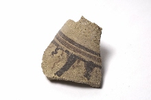 Fragment of a vase decorated with lines and wavy lines