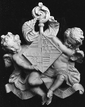 Shield hold by cherubs