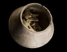 Carinated vase with flaring rim and human remains