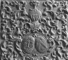 Fireplace fireback: coat of arms and foliated scrolls