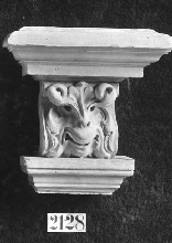Console with foliage with the shape of a mask
