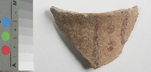 Shard of pinkish pottery with brown decoration