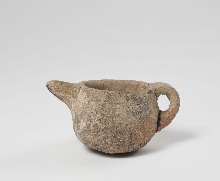 Cup with spout and handle