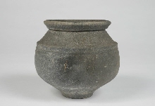 Grey clay pot with brownish surface
