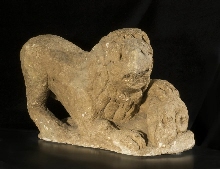 Striking lion and ram's head (funeral monument)