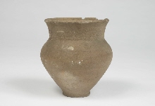 Grey clay pot with brownish surface