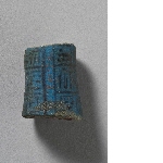 Fragment of a funerary figurine with inscription