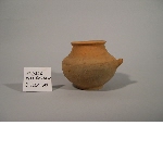 Bottle made of soft and micaceous orange-coloured clay