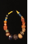 Necklace with decorated beads in glass and stone