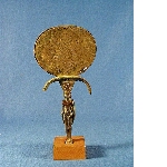 Mirror with handle in the shape of a figurine