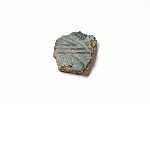 Fragment of blue glazed pottery with plant motif