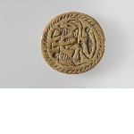 Button seal decorated with lizard, man and Hathor sistrum