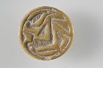 Button seal decorated with seated figure holding a lotus