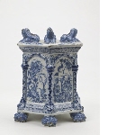 Hexagonal socle of a bouquet holder, decorated with putti