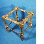 Wooden stool with legs in the shape of papyrus plants and duck heads