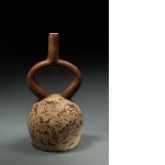 Vessel with stirrup-shaped handle
