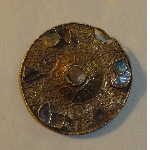 Disc shaped 'clipéforme' fibula with filigree