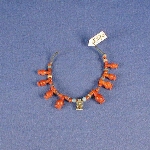 Bracelet with beads, eight pendants and an amulet of a squatting monkey