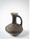 Grey-black carafe with incised decoration