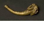 Gold wieight representing a horn