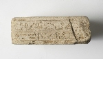 Base of a figurine with inscription
