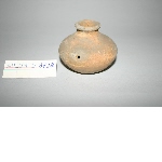 Bottle made of orange clay without handle