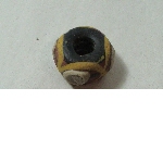 Glass bead decorated with buttons in relief