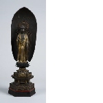 Buddha Amida standing on lotus, before a mandorla