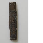 Fragment of ebony with silver inlay and inscription