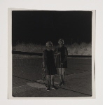 Two girls posing on a tennis court
