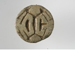 Button seal decorated with ibex